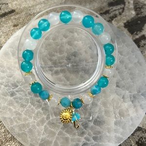 Handcrafted bracelet with sun and umbrella charms